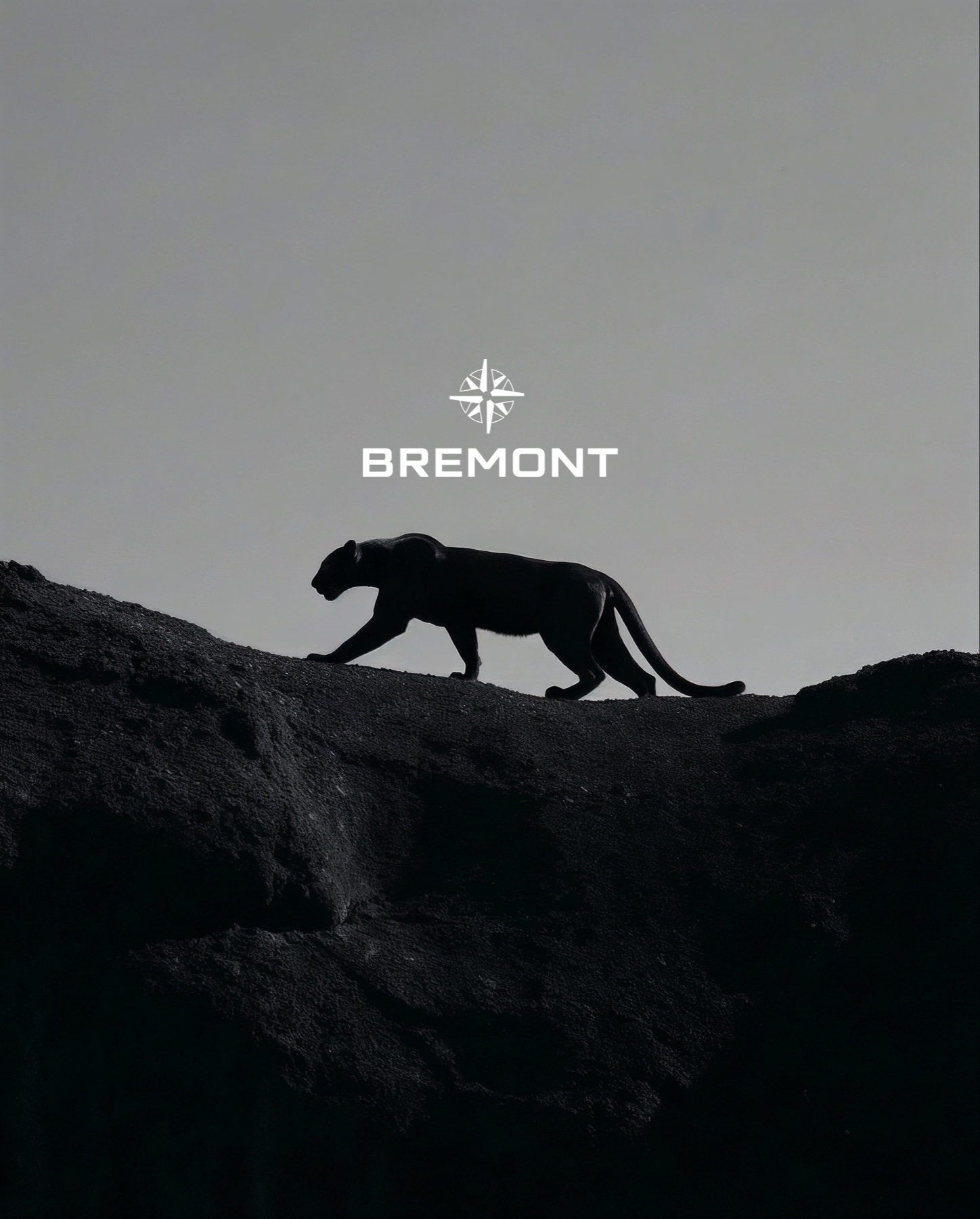 Bremont Watches campaign cover with panther silhouette on dark terrain and Bremont logo