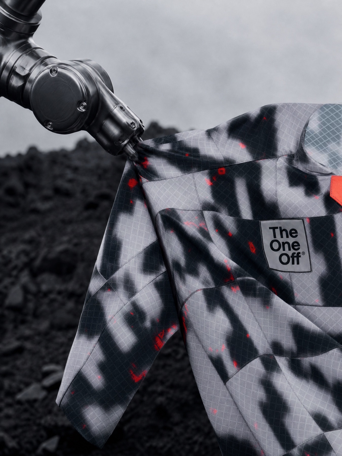 Gobik Wear campaign cover with technical garment, robotic arm and red detail in a dark outdoor setting